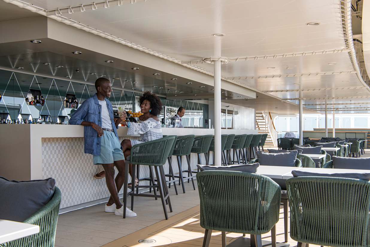 A couple enjoying a drink on a MSC Cruise ship